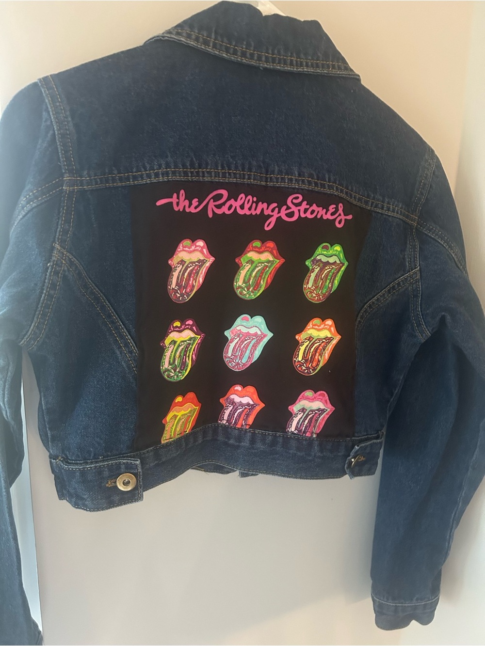 Cropped denim jacket with Rolling Stones on the back